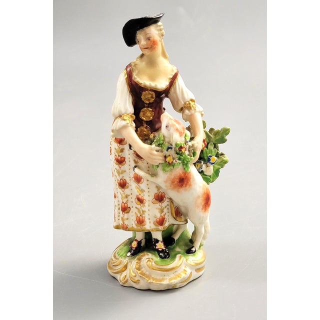 A Georgian Derby porcelain figure of a shepherdess with a lamb, dating to c.1756–1759. Produced during the Pale Family...