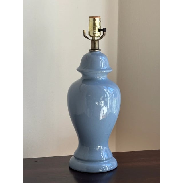 Offering a beautiful cornflower blue ginger jar table lamp from the mid-20th century. This gorgeous ceramic table lamp is...