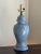 Offering a beautiful cornflower blue ginger jar table lamp from the mid-20th century. This gorgeous ceramic table lamp is...