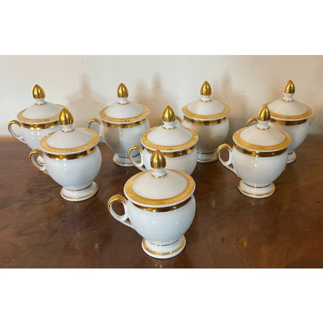 Set eight early 19th c. Paris porcelain pot de creme with gold bands on a white ground. Wonderful neoclassical shape. Good...