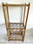 Rattan Two Tier Shelving unit with lower wine rack thar hold 16 bottles. Two glass shelves measure 17x9.5 Space between...