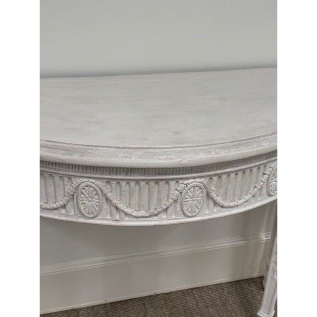 Louis XVI Ornately Carved Wood Demi-Lune With White Gesso Finish with Slight Distressing to Finish (See Photos).