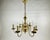 Elevate your interior with this stunning vintage brass chandelier, a true masterpiece of Belgian craftsmanship from the...