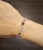 This modern rainbow sapphire bracelet is a vibrant expression of color and sophistication, beautifully crafted in...