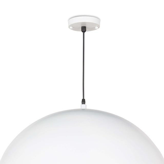 A simple dome shade brings sleek minimalism to the mix. Featuring a gold-leafed finish on the shade’s interior, this gives...