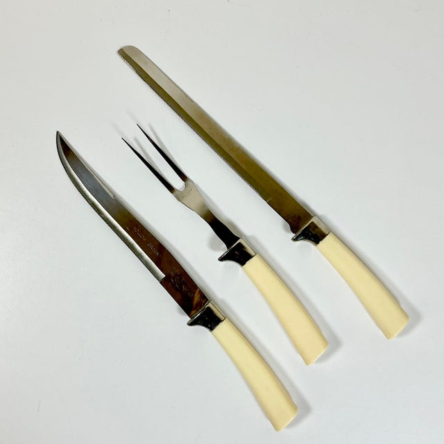 This set of two carving knives and fork have stainless steel blades from the famous factories in Sheffield England. The...