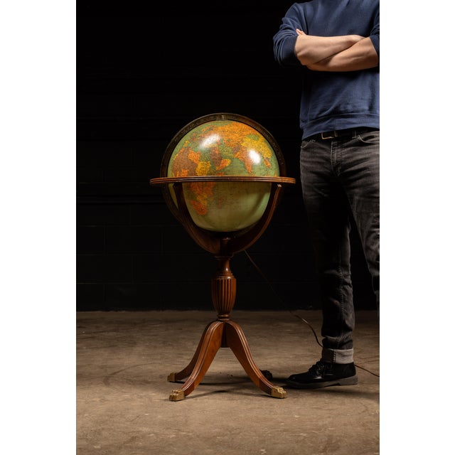 Large illuminated floor globe manufactured by Replogle Globes of Chicago, dating to the 1930s–1940s. The globe is...