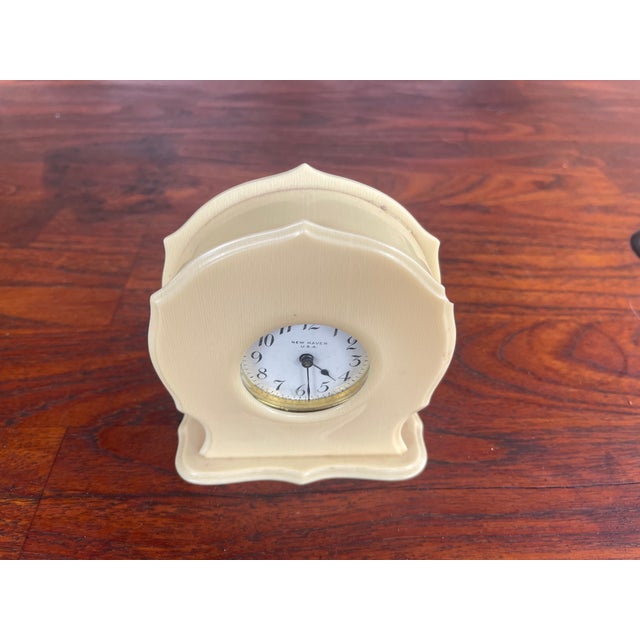This is a vintage New Haven Clock Company DuBarry Ivory Pyralin celluloid vanity clock from the 1920s-1930s. The case is...