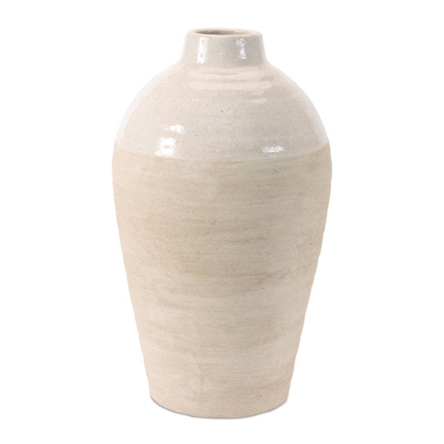 Elevate your décor with the understated elegance of this Two-Tone Rounded Stoneware Container. Designed with a softly...