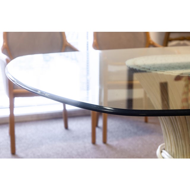 A vintage Dorothy McGuire Sheaf of Wheat dining table. This lovely mid century dining table features a glass and bamboo...