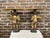 Two wonderfully carved wood Baroque style cherub side tables with a painted polychromed and partial gesso finish. Each...