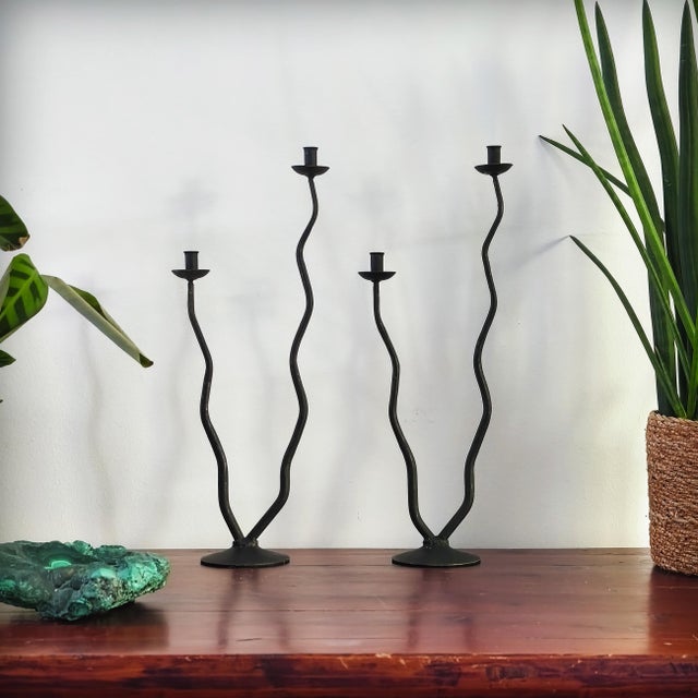 Pair of two-branch wrought iron candlesticks made by Hysteria Design in France in the 1980s. The style is both brutalist...