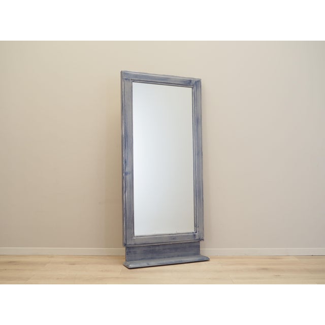 The mirror was made in the 1960s, Danish production. The mirror frame is made of solid beech wood stained in blue and grey...