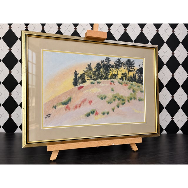 Original 1980 colored pencil landscape drawing depicting a softly sunlit meadow bordered by a dramatic wooded horizon....