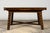 A late 19th century English Jacobean style extendable dining table crafted from walnut, circa 1880–1900. The table...