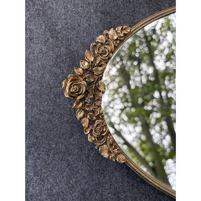 Vintage mirrored vanity tray in gold finish with pretty floral design handles. Dark felt back to protect furniture. Tray...