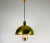 Extraordinary polished brass pendant lamp designed by Florian Schulz and made in Germany in the 1970s. It is fascinating...