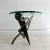 Pucci De Rossi (1947-2013) Occasional table with two interlocking panels of ⅝” thick steel cut into abstract forms with...
