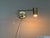 Design Plus Gallery presents a Modern Swing Arm Wall Lamp. The circular wall plate supports two articulated arms that...
