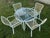 Vintage Brown Jordan Tamiami 5 Piece Metal and Plastic Strap Patio Set. There is a round table and 4 armchairs designed...