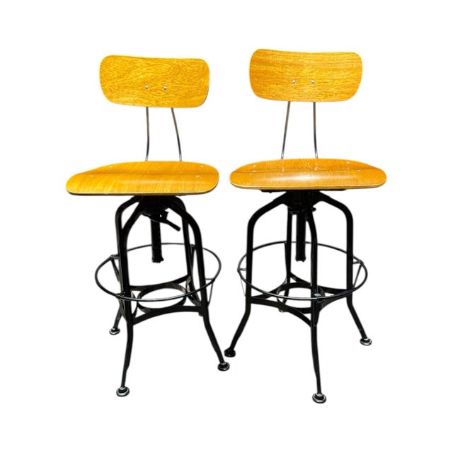 Designed with an industrial aesthetic, these molded plywood stools combine durability with modern style. The seat height...