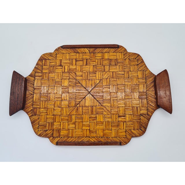 A unique, decorative vintage-style wooden tray, crafted from numerous small pieces of wood that form a striking, geometric...