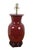 Late 20th century Chinoiserie vase shaped oxblood red porcelain table lamp with wooden base. Includes harp, pink glass orb...