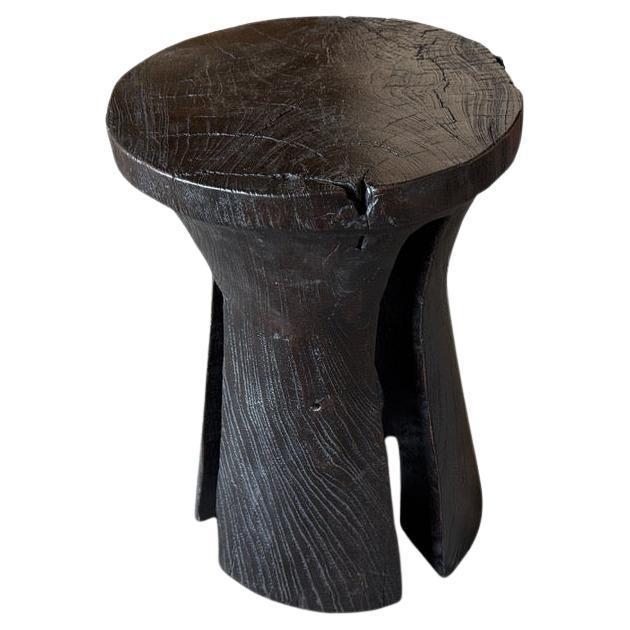 A century old teak wood mortar originally used to grind rice, is repurposed into this minimalist tall side table, stool or...