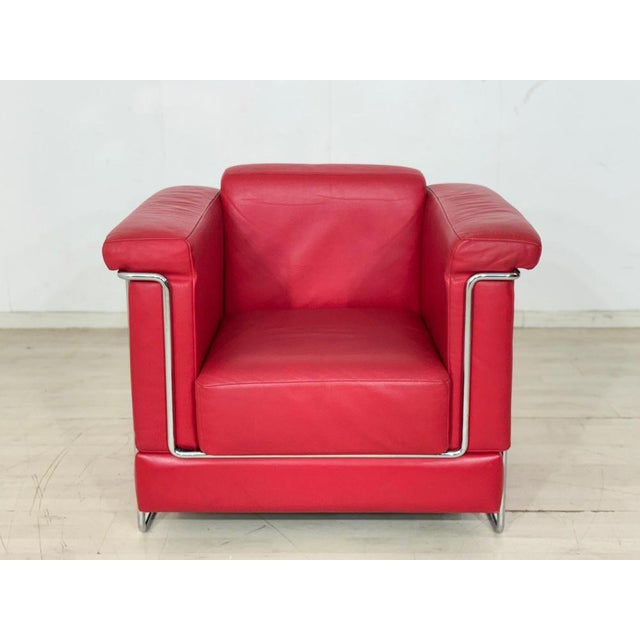 The Carat armchair by Züco is upholstered in black leather and stands on slender metal legs. The individual upholstered...
