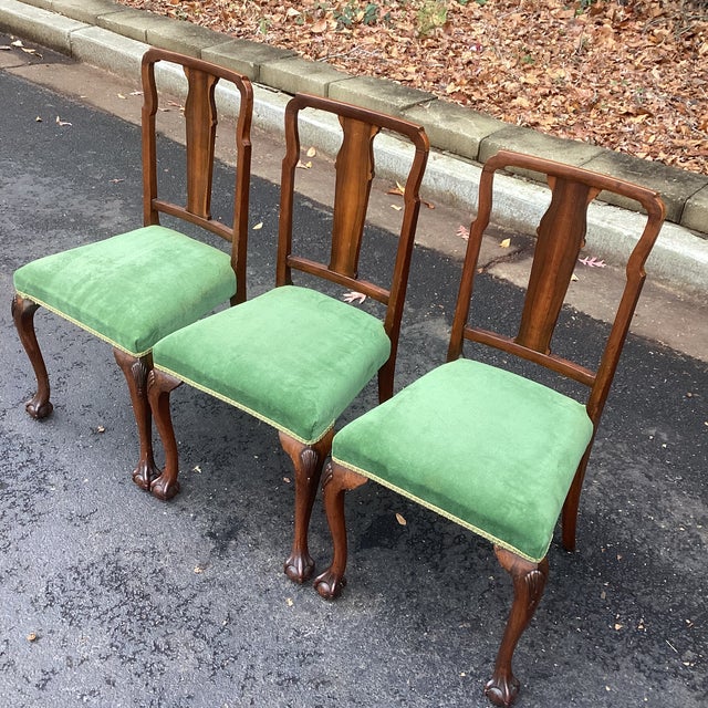 Elevate your dining room or breakfast nook with this elegant set of three vintage Queen Anne–style chairs, featuring...