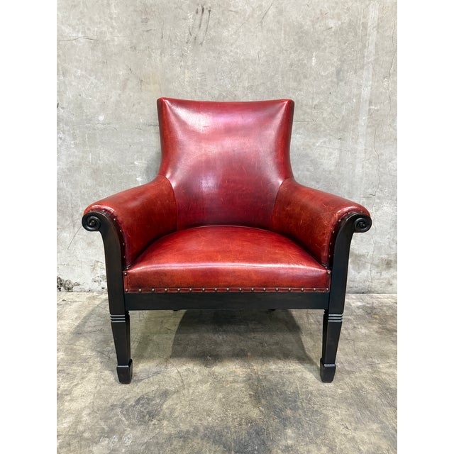 Exceptional custom club. The chair is a study in restrained, confident design: a curved, enveloping back and rolled arms...