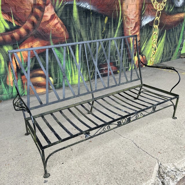 Salterini outdoor 3 seat sofa. This piece comes with 6 cushions and has leaf accents in the iron. All measurements are...