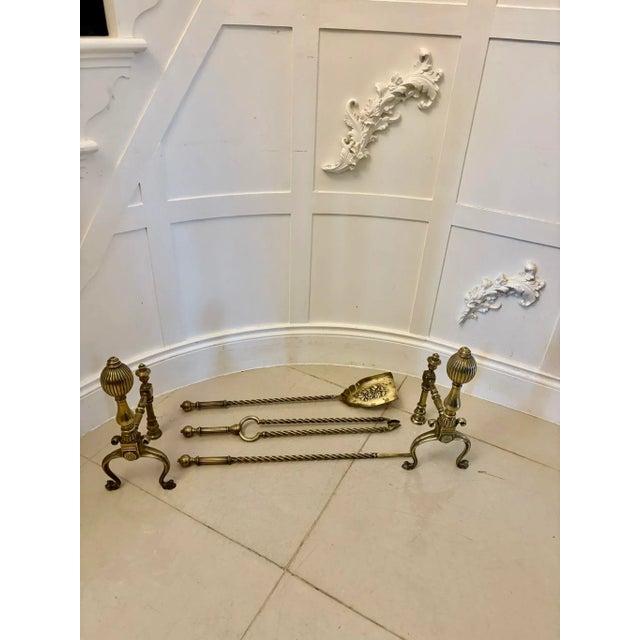 Set of quality antique Victorian brass fire irons and dogs having a pair of quality brass fire dogs with matching fire...