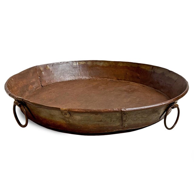 Vintage large rustic industrial style round iron tray from India. Hand-formed from heavy-gauge iron, its broad, shallow...