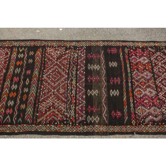 Vintage Moroccan nomadic Tuareg rug, black camel hair with wool and cotton embroidered geometrical modernist designs. This...