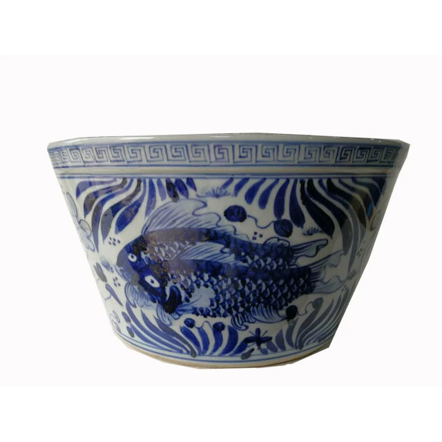 This large blue and white planter is hand-made and hand-painted with traditional blue and white motif by ceramist from...