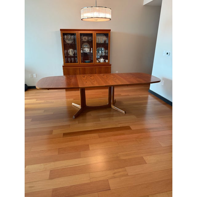 Beautiful teak dining table by Gudme Møbelfabrik comes with two self-stored leaves. Excellent condition. Note - additional...