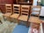 Design Plus Gallery presents a Set of Four Antique Ladder-back Dining Room Chairs from the Victorian Era. The chairs have...