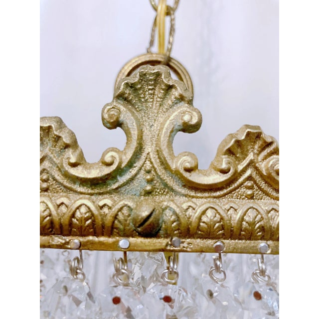 This is an Italian brass rim chandelier dressed with octagon bead and Plug cut crystals. It has 1 Edison base socket....