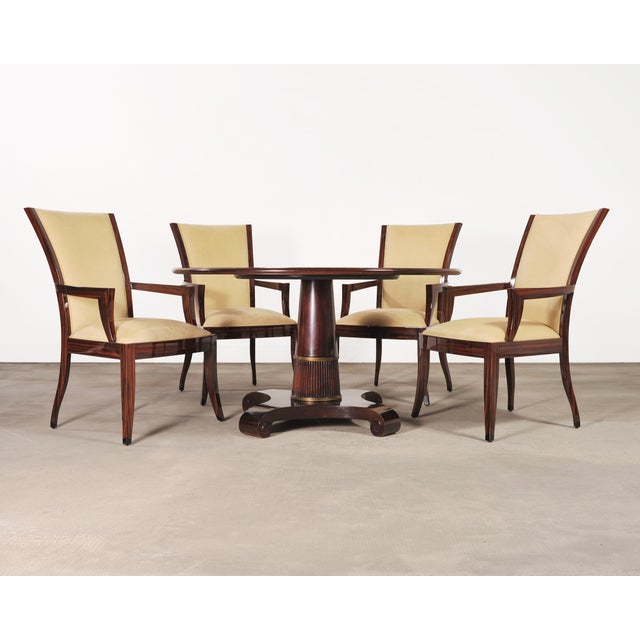 An elegant round Regency style mahogany pedestal table designed by Thomas Pheasant for Baker Furniture. The Baker table...