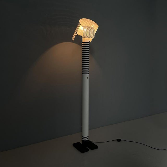 Italian modern metal floor lamp Shogun by Mario Botta for Artemide, 1980s Shogun floor lamp in black and white painted...