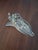 Swarovski Crystal Memories Power Boat figurine (Swarovski part number 272554). This collectible piece features a clear...