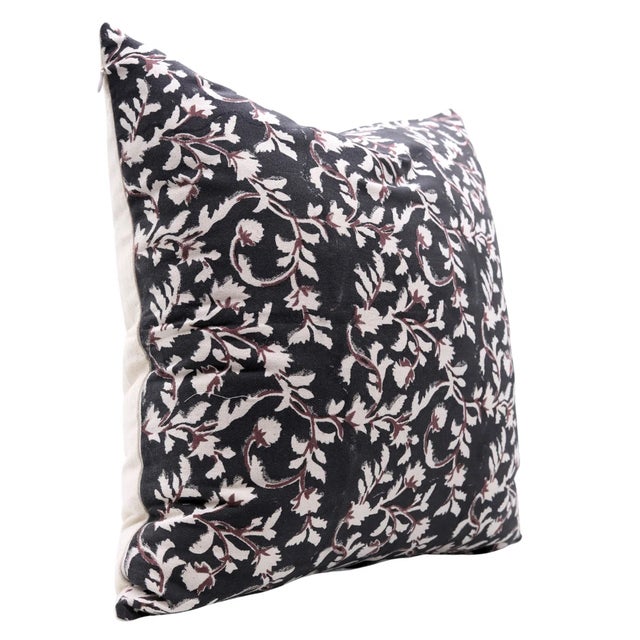 Bursting with floral charm, the Pushpa Varsha cushion cover—meaning “a shower of flowers”—features a delicate hand block...