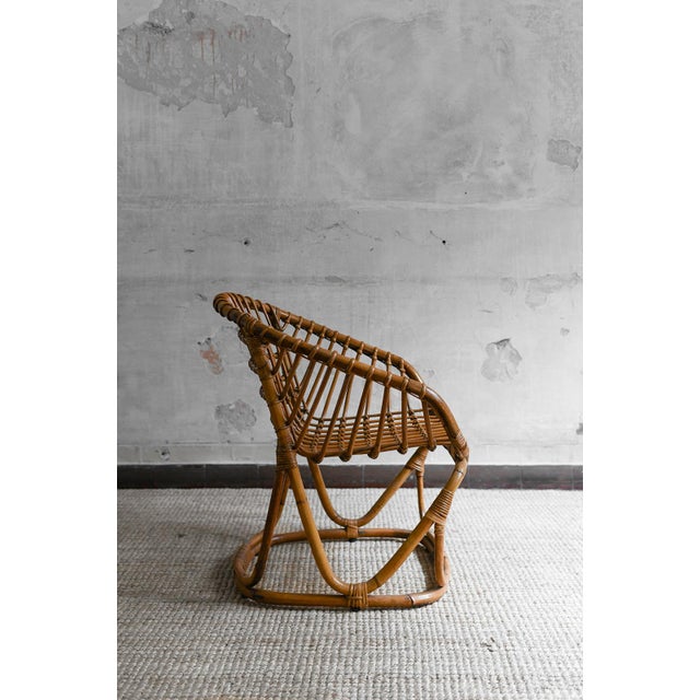 Set of 4 Woven Bamboo Armchairs in the style of Tito Agnoli, 1970s Product Details Dimensions: 66 W x 75 H x 65.5 D cm...