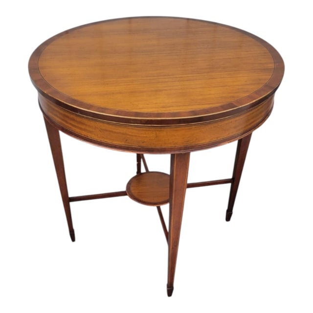 Elegant English Baker Furniture Limited Edition round side table crafted from fine mahogany with delicate inlaid details....