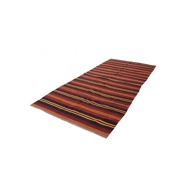 Handwoven vintage striped decorative kilim rug from Denizli region of Turkey. Approximately 50-60 years old. In very good...