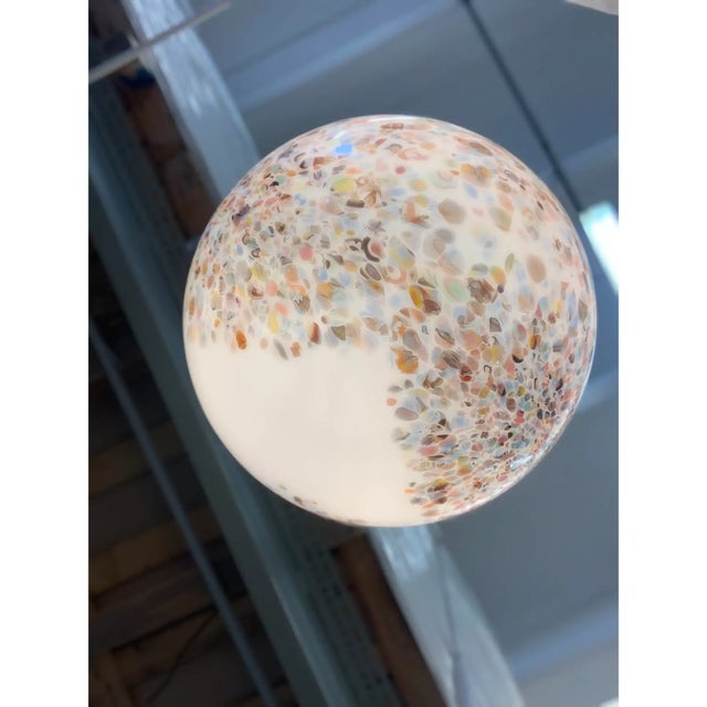 Contemporary elegant milky-white sphere in Murano glass with multicolored Murrine. Floeal design in very particular and...