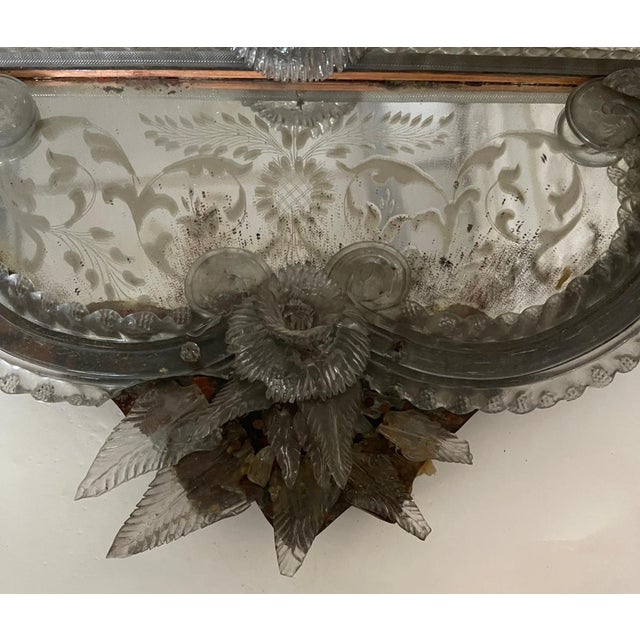 An important and captivating Venetian mirror, crafted between the late 19th and early 20th centuries. This work stands out...