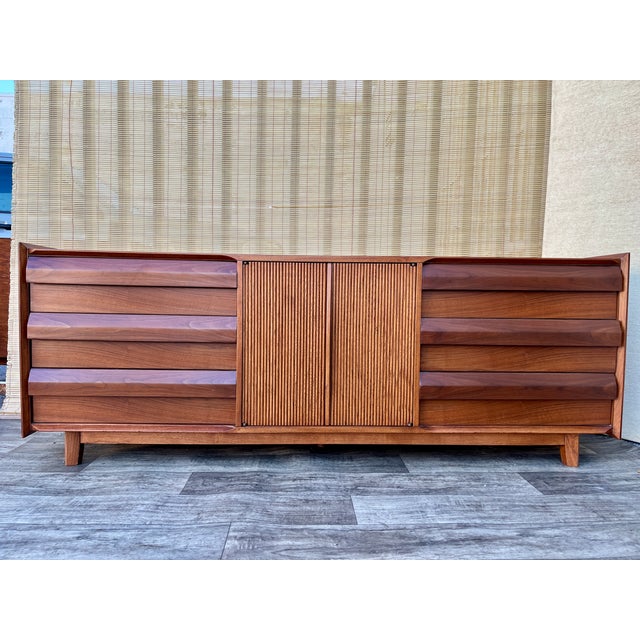 Vintage Fully Refinished Mid Century Modern 9 Drawers Dresser / Credenza by Lane Altavista Furniture. Circa 1960s Features...