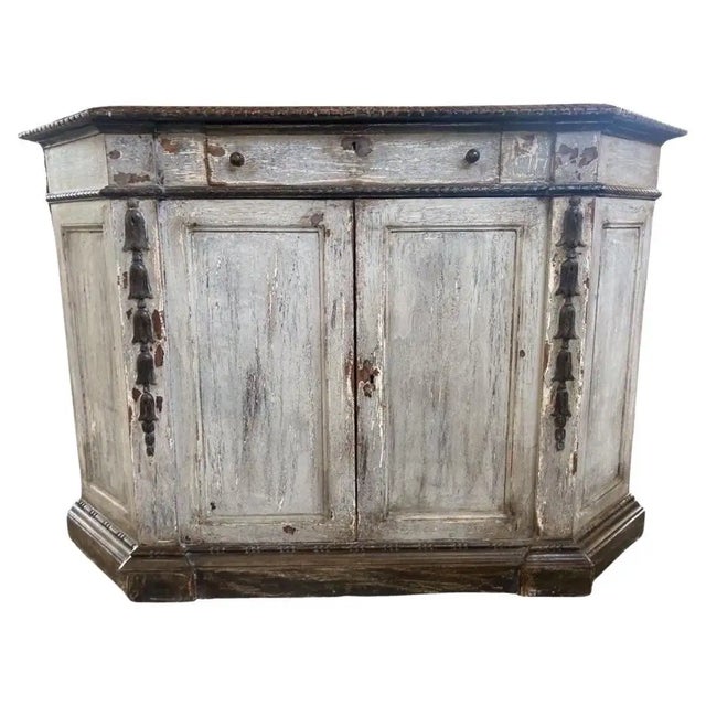 Credenza hand-made in Italy in the mid 1800s using pine. The credenza is pretty large and shows the typical Italian...